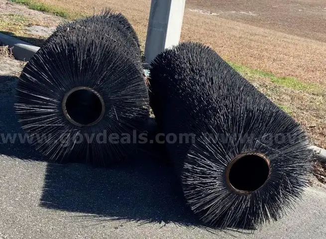 (2) USED BLACK STREET SWEEPING BRUSHES.