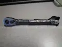 (1) USED SOCKET WRENCH; (1) SET OF SOCKET ATTACHMENTS