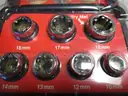 (1) USED SOCKET WRENCH; (1) SET OF SOCKET ATTACHMENTS