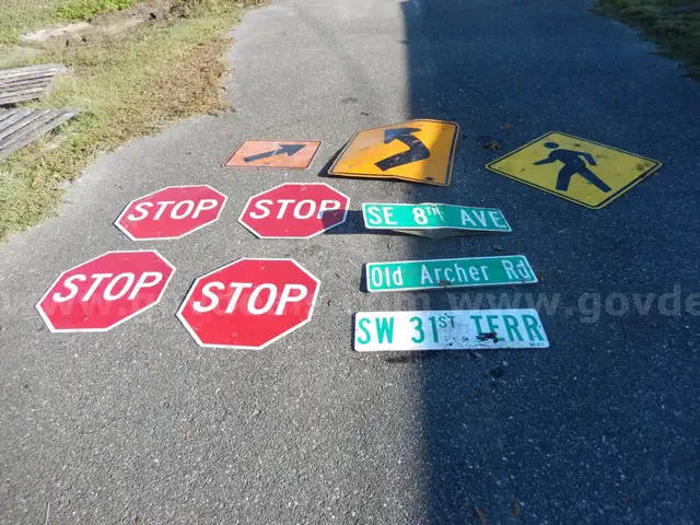 USED (4) STOP SIGNS, (3) STREET SIGNS, (1) PEDESTRIAN SIGN, (1) LEFT TURN SIGN, (1) ARROW SIGN