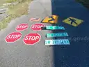 USED (4) STOP SIGNS, (3) STREET SIGNS, (1) PEDESTRIAN SIGN, (1) LEFT TURN SIGN, (1) ARROW SIGN