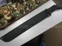 (1) USED MACHETE IN BLACK SHEATH; (1) USED SOG KNIFE IN BLACK SHEATH; (1) USED LEATHER HOLSTER; (1) USED CAMO HOLSTER
