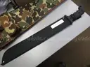 (1) USED MACHETE IN BLACK SHEATH; (1) USED SOG KNIFE IN BLACK SHEATH; (1) USED LEATHER HOLSTER; (1) USED CAMO HOLSTER