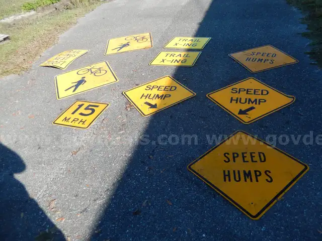 USED (4) SPEED HUMP SIGNS, (2) TRAIL X-ING SIGNS, (2) BIKE AND PEDESTRIAN SIGNS, (1) ARROW SIGN, (1) 15 MPH SIGN