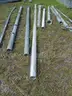 USED (2) ALUMINIUM ROUND POLES, (6) METAL TRAFFIC POLES, (1) SQUARE SIGN POST, (1) ALUMINIUM CURVED POLE
