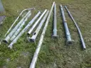 USED (2) ALUMINIUM ROUND POLES, (6) METAL TRAFFIC POLES, (1) SQUARE SIGN POST, (1) ALUMINIUM CURVED POLE