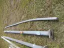 USED (2) ALUMINIUM ROUND POLES, (6) METAL TRAFFIC POLES, (1) SQUARE SIGN POST, (1) ALUMINIUM CURVED POLE