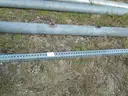 USED (2) ALUMINIUM ROUND POLES, (6) METAL TRAFFIC POLES, (1) SQUARE SIGN POST, (1) ALUMINIUM CURVED POLE