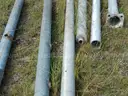 USED (2) ALUMINIUM ROUND POLES, (6) METAL TRAFFIC POLES, (1) SQUARE SIGN POST, (1) ALUMINIUM CURVED POLE