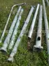 USED (2) ALUMINIUM ROUND POLES, (6) METAL TRAFFIC POLES, (1) SQUARE SIGN POST, (1) ALUMINIUM CURVED POLE