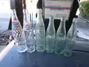 (115) RECOVERED GLASS BOTTLES AND JARS