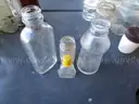 (115) RECOVERED GLASS BOTTLES AND JARS