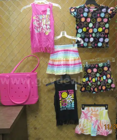 (1) NEW, BOGG BAG WITH M/M 7/8 GIRLS SHIRTS & SKORTS.