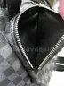 (1) LIKE-NEW BLACK AND GRAY CHECKERED BACKPACK
