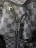 (1) LIKE-NEW BLACK AND GRAY CHECKERED BACKPACK