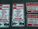 USED (4) RESERVED CONSTRUCTION VEHICLES ONLY SIGNS, (1) DO NOT BLOCK SIGN, (2) NO PARKING VALET PARKING SIGNS