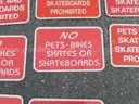 USED (1) ONE WAY SIGN, (1) CAUTION LOW SPEED SIGN, (8) PETS- BIKE, SKATES, AND SKATEBOARD PROHIBITED SIGNS