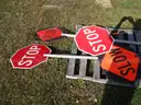 (4) USED TRAFFIC STOP/SLOW SIGNS