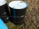 USED (3) 55 GALLON BLACK METAL DRUMS, (1) 55 GALLON BLUE METAL DRUM, (3) 30 GALLONBLUE PLASTIC DRUMS
