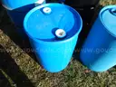 USED (3) 55 GALLON BLACK METAL DRUMS, (1) 55 GALLON BLUE METAL DRUM, (3) 30 GALLONBLUE PLASTIC DRUMS