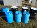 USED (3) 55 GALLON BLACK METAL DRUMS, (1) 55 GALLON BLUE METAL DRUM, (3) 30 GALLONBLUE PLASTIC DRUMS