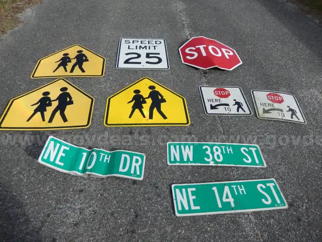 USED (3) PEDESTRIAN CROSSING SIGNS, (3) STREET SIGNS, (1) SPEED LIMIT 25 SIGN, (2) STOP HERE FOR PEDESTRIAN SIGNS