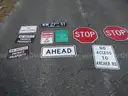 USED (2) STOP SIGNS, (1) NO SOLICITING SIGN, (1) STREET SIGN, (1) AHEAD SIGN, (2) NO OUTLET PRIVATE PROPERTY SIGNS