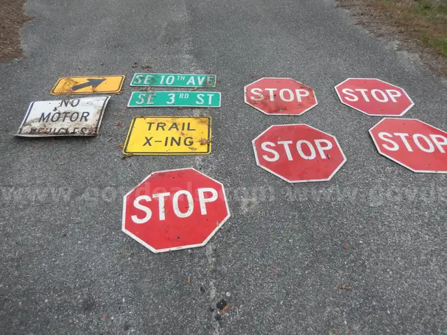 USED (5) STOP SIGNS, (2) STREET SIGNS, (1) TRAIL X-ING, (1) NO MOTOR VEHICLES, (1) ARROW SIGN