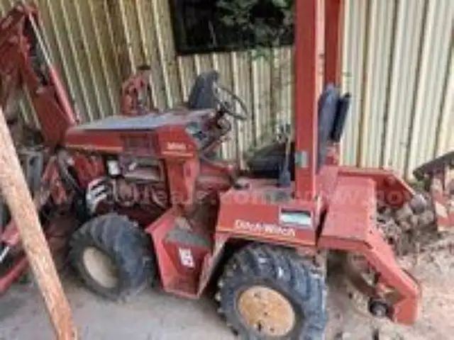 Ditch Witch ditching machine with backhoe and chain trencher