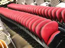 Set of 81 Red KI Folding Chairs with Casters and Armrests