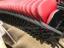 Set of 81 Red KI Folding Chairs with Casters and Armrests