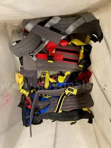 Bin of Various Rehab Harnesses