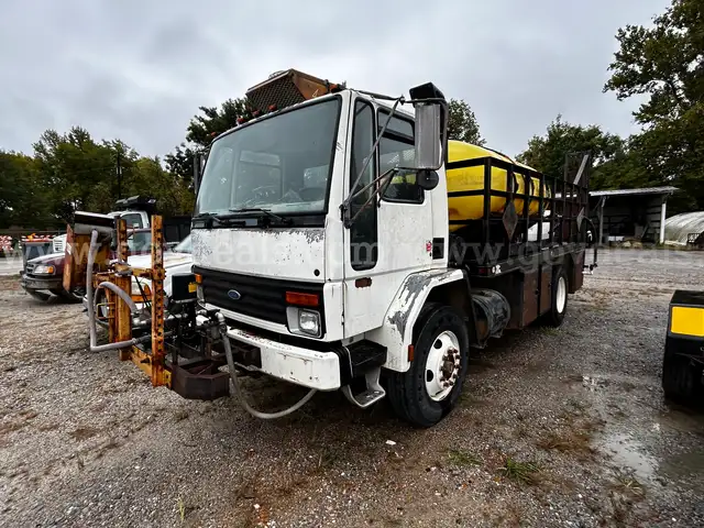1994 Ford CF7000 Flatbed Truck with 1000 Gallon Water Tank