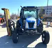 2010 New Holland T5060 2WD Cab Tractor With Side and Rear Flail Mowers