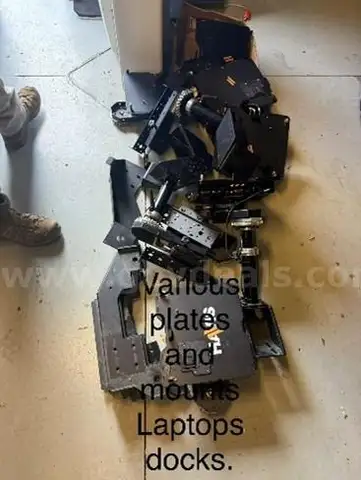 Lot of various plates, mounts, and laptop docks