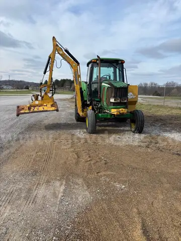 JOHN DEERE 6615 WITH TIGER MOWER ON IT