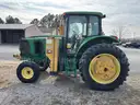 JOHN DEERE 6615 WITH TIGER MOWER ON IT
