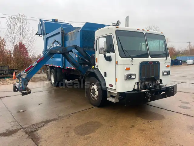 2017 Peterbilt 320 with 28yd Heil Dura Pack side loading refuse body