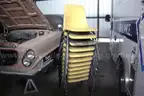 Lot of misc yellow chairs, cloth chairs. shelves, desk, cabinets,