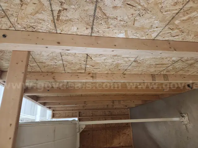 Disassembled 7' X 16' X 8' interior room with a locking man door