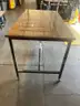 Larger bar height Glass top wood table with casters