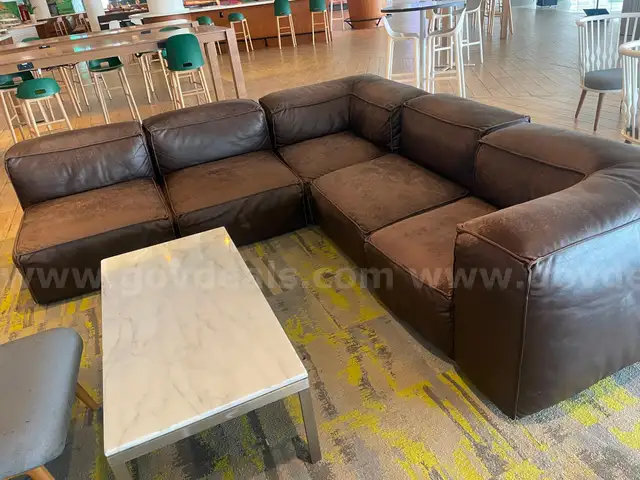 brown sectional couch with marble coffee table and gray chair