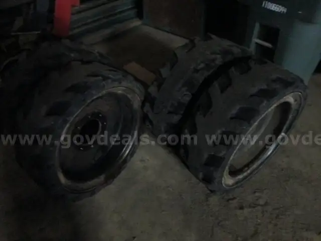 Solid skid steer tires/wheels