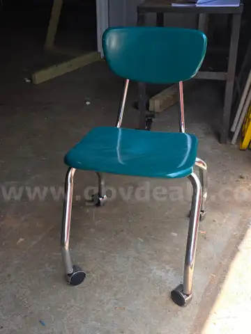 Twelve Metal Rolling Chairs