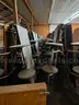 12 Lunch Tables with 12 Black Stool Like Seats