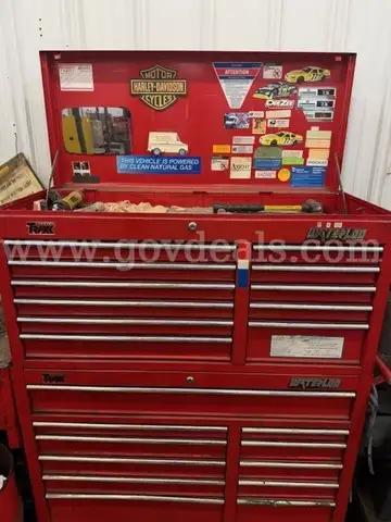 Metal rolling toolbox containing various tools
