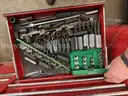 Metal rolling toolbox containing various tools