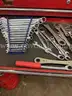 Metal rolling toolbox containing various tools