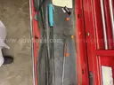 Metal rolling toolbox containing various tools