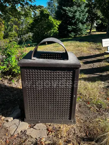 Brown Metal Trash Can